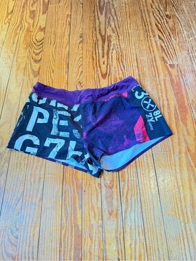 Reebok Women's Purple and Black Graphic Athletic Shorts